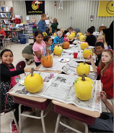 Pumpkin painting used to teach Colby third graders about agriculture, FFA